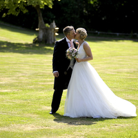 Kent Hair & Makeup Artist | The Bride and Groom kissing after the wedding ceremony in Kent