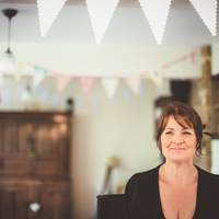 Kent Hair & Makeup Artist | Bride admiring her hair and makeup before her wedding