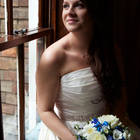 Kent Hair & Makeup Artist | Bride holding her bouquet looking out of the window