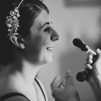 Kent Hair & Makeup Artist | Bride laughing whilst makeup is applied